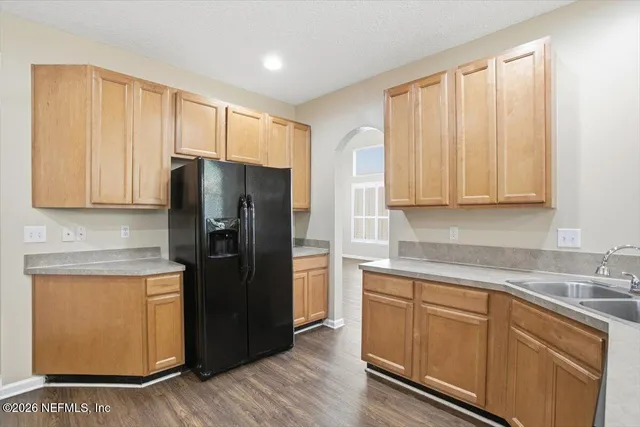 a bedroom with a bed couch and a window