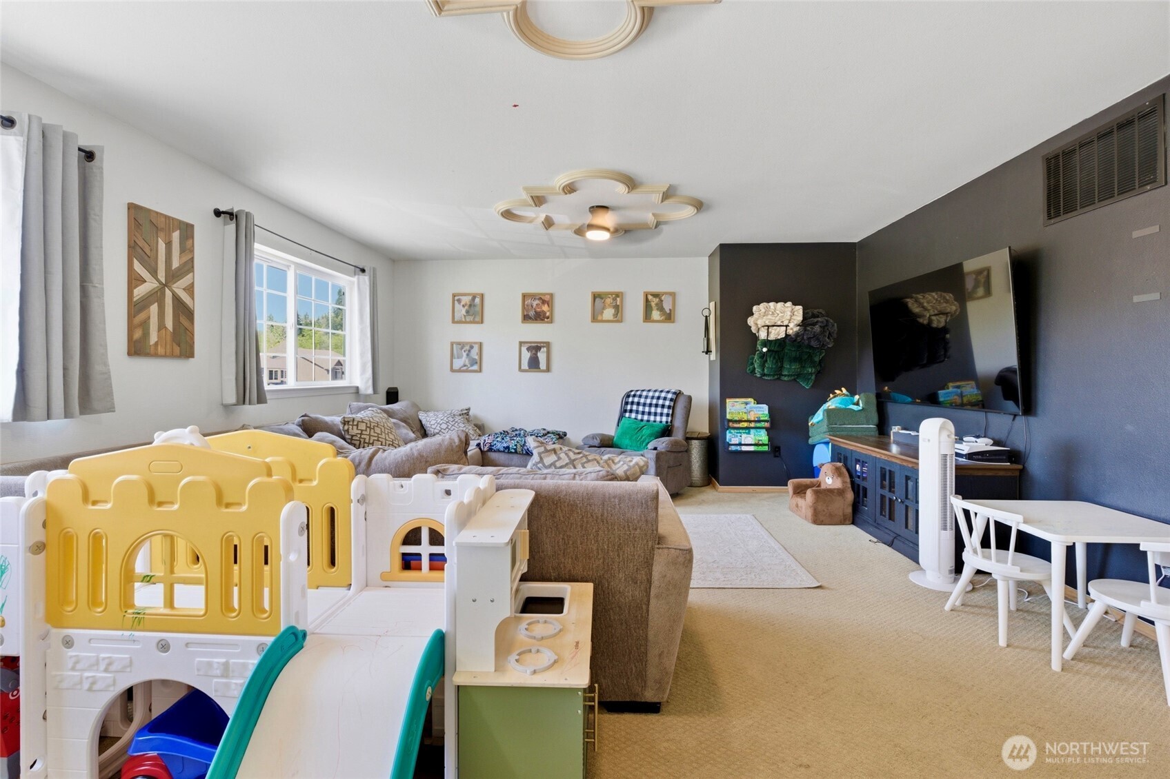 14005 Cedar Court Sultan, WA 98294 - Photo 15 of 38 a living room with furniture a flat screen tv and a window