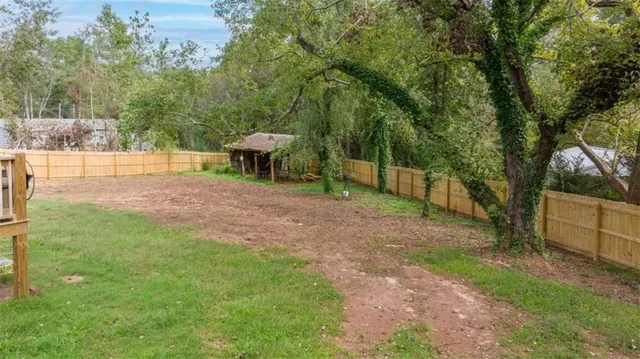 a view of a yard with a tree