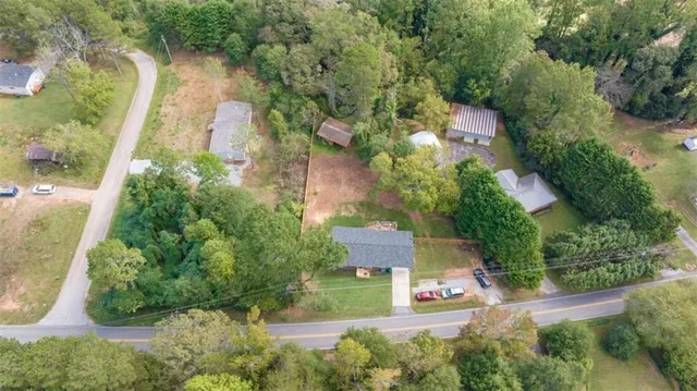 an aerial view of a house with outdoor space and street view