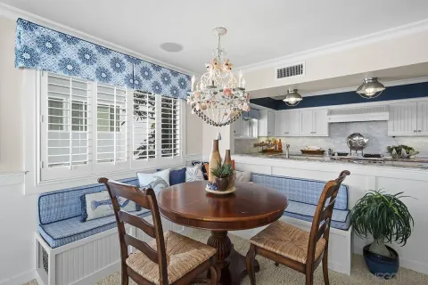 a kitchen with stainless steel appliances granite countertop a sink refrigerator and cabinets
