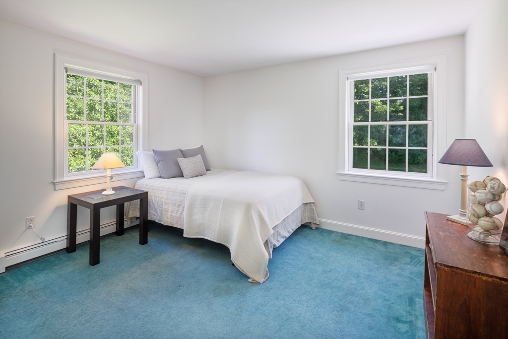 53 South Hampton Road Amesbury, MA 01913 - Photo 31 of 39 a bedroom with a bed and a window