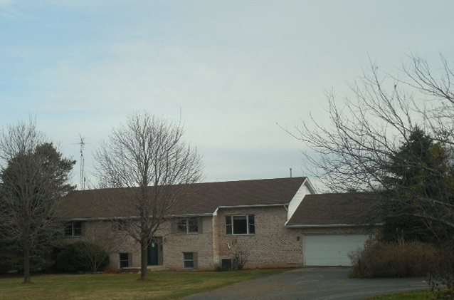17529 Burr Oak Road Capron, IL 61012 - Photo 1 of 21 front view of house with a yard