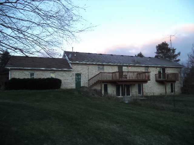 17529 Burr Oak Road Capron, IL 61012 - Photo 3 of 21 a view of a house with a garden