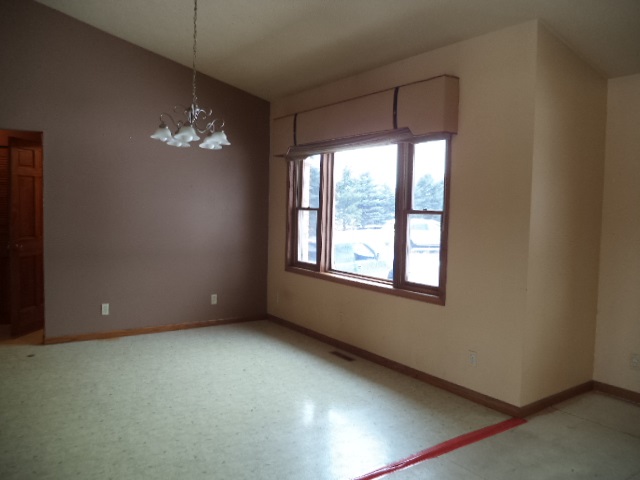 17529 Burr Oak Road Capron, IL 61012 - Photo 7 of 21 a view of room with a ceiling fan and a window