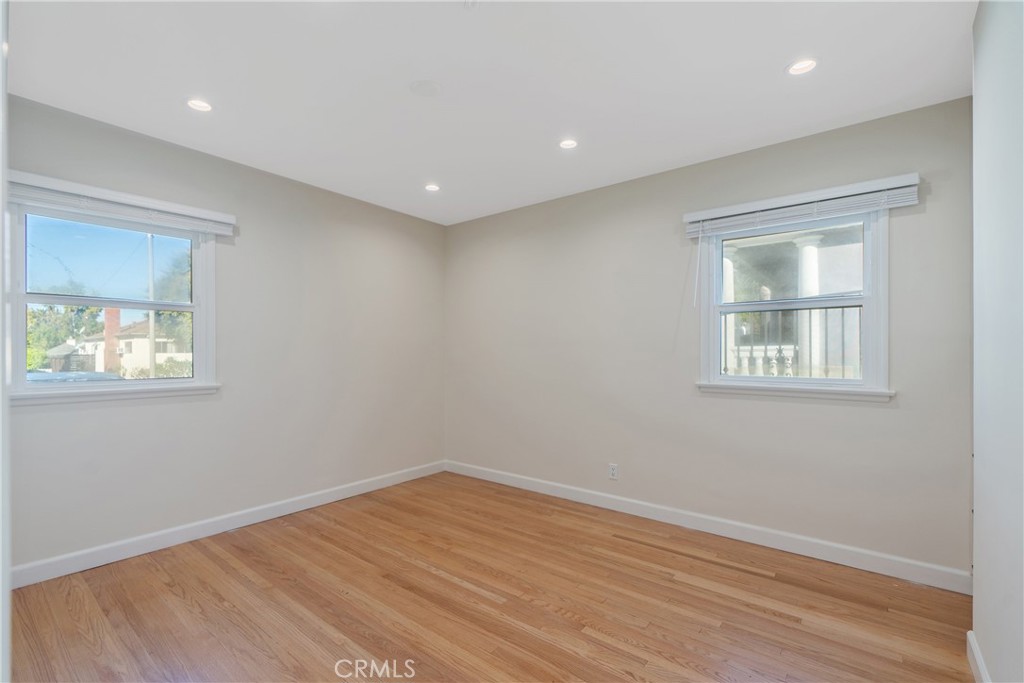 3054 North Frederic Street Burbank, CA 91504 - Photo 12 of 21 a view of empty room with wooden floor and fan