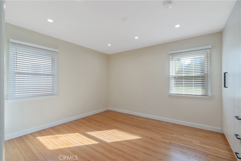 3054 North Frederic Street Burbank, CA 91504 - Photo 14 of 21 a view of an empty room with wooden floor and a window
