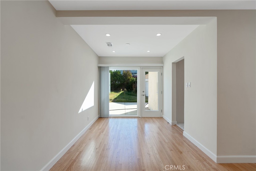 3054 North Frederic Street Burbank, CA 91504 - Photo 5 of 21 a view of a big room with wooden floor and windows