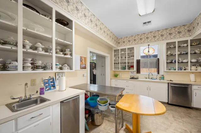 a kitchen with a sink and cabinets