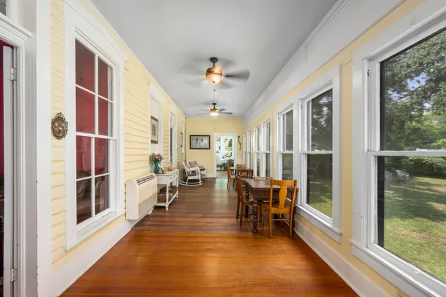 a view of a dining room with furniture window and outside view