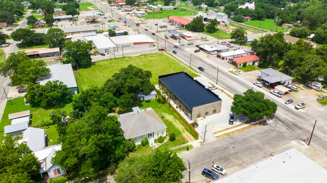 an aerial view of a house with a garden