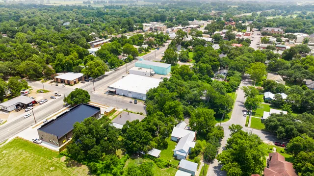 an aerial view of residential houses with outdoor space