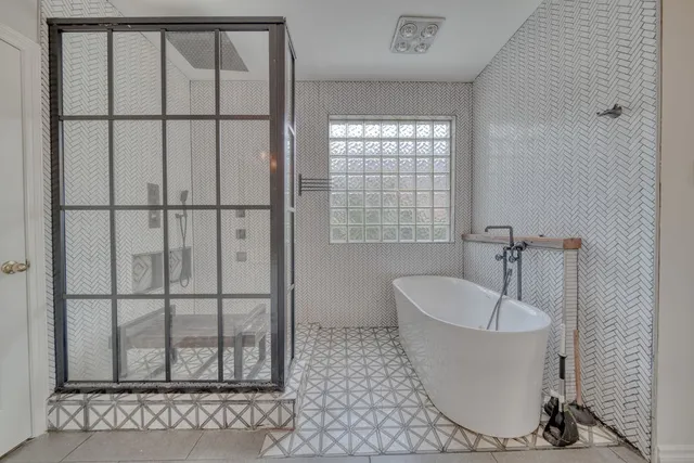 a view of a field of grass and trees