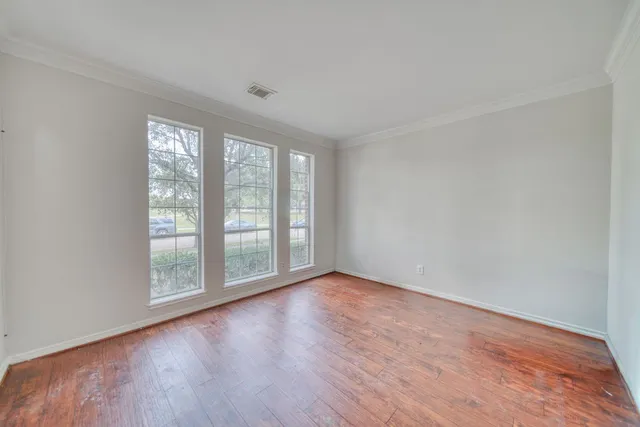 a living room with fireplace furniture and a flat screen tv