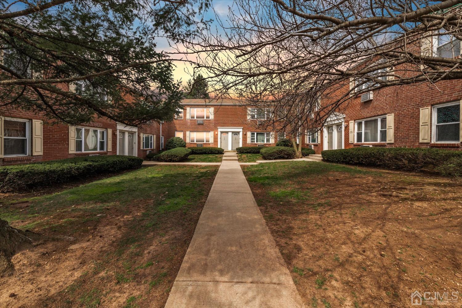 50 Fox Road, Unit 7A Edison, NJ 08817 - Photo 2 of 17 a front view of a house with yard and green space