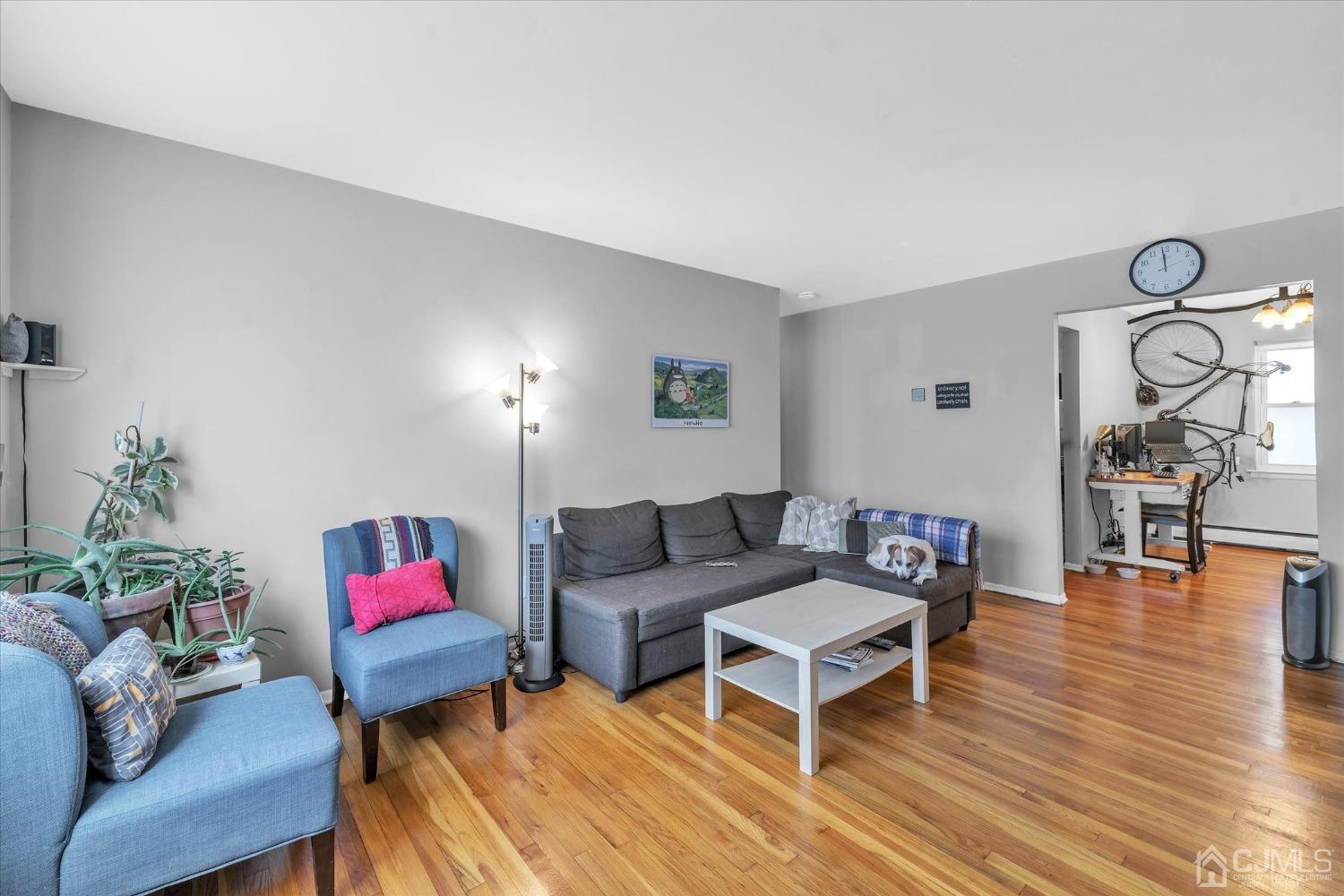 50 Fox Road, Unit 7A Edison, NJ 08817 - Photo 4 of 17 a living room with furniture and wooden floor