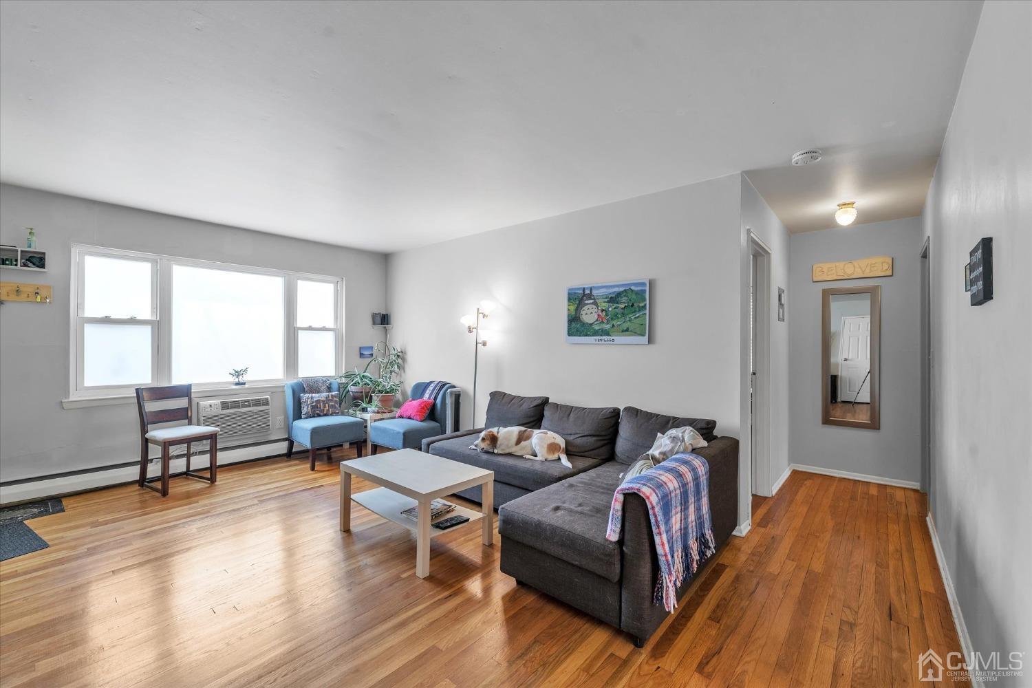 50 Fox Road, Unit 7A Edison, NJ 08817 - Photo 5 of 17 a living room with furniture and a wooden floor