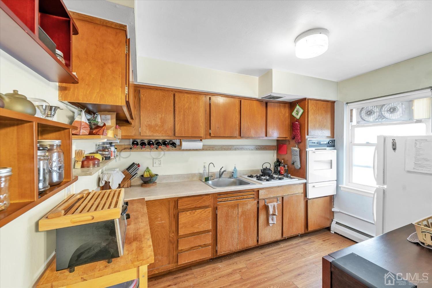 50 Fox Road, Unit 7A Edison, NJ 08817 - Photo 7 of 17 a kitchen with a sink stove and refrigerator