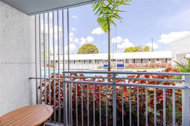 a view of swimming pool with outdoor seating