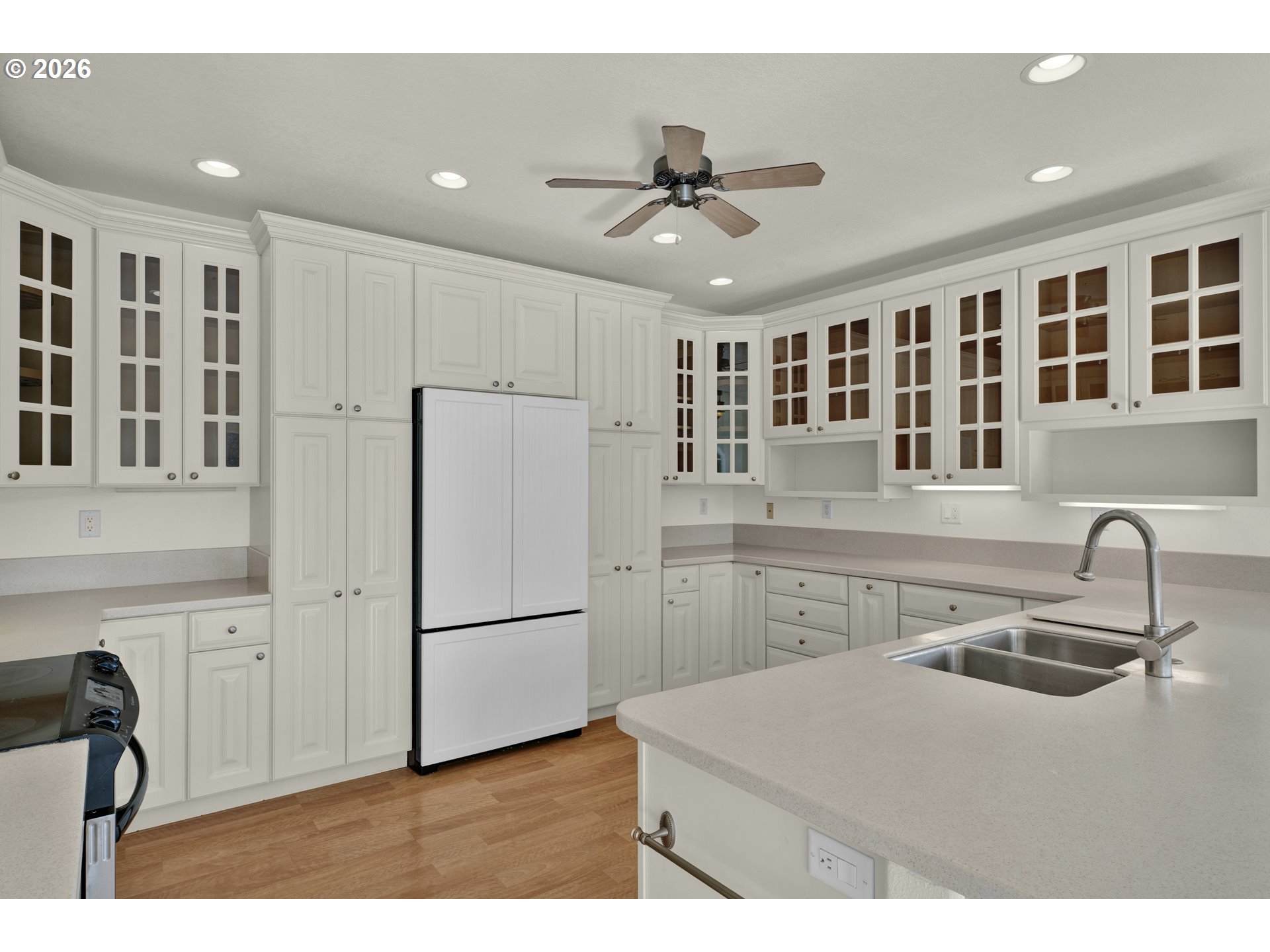 5816 Martin Road Florence, OR 97439 - Photo 17 of 47 a kitchen with a refrigerator a sink and cabinets