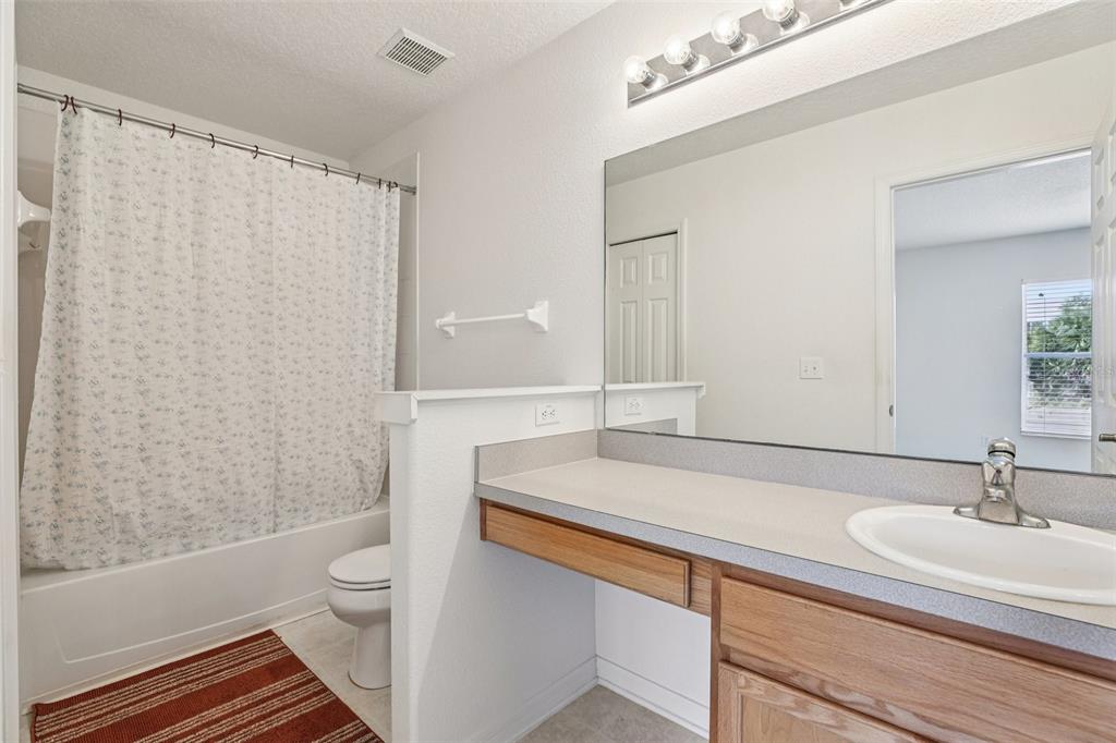 263 Sterling Springs Lane Altamonte Springs, FL 32714 - Photo 13 of 22 a bathroom with a sink and a mirror