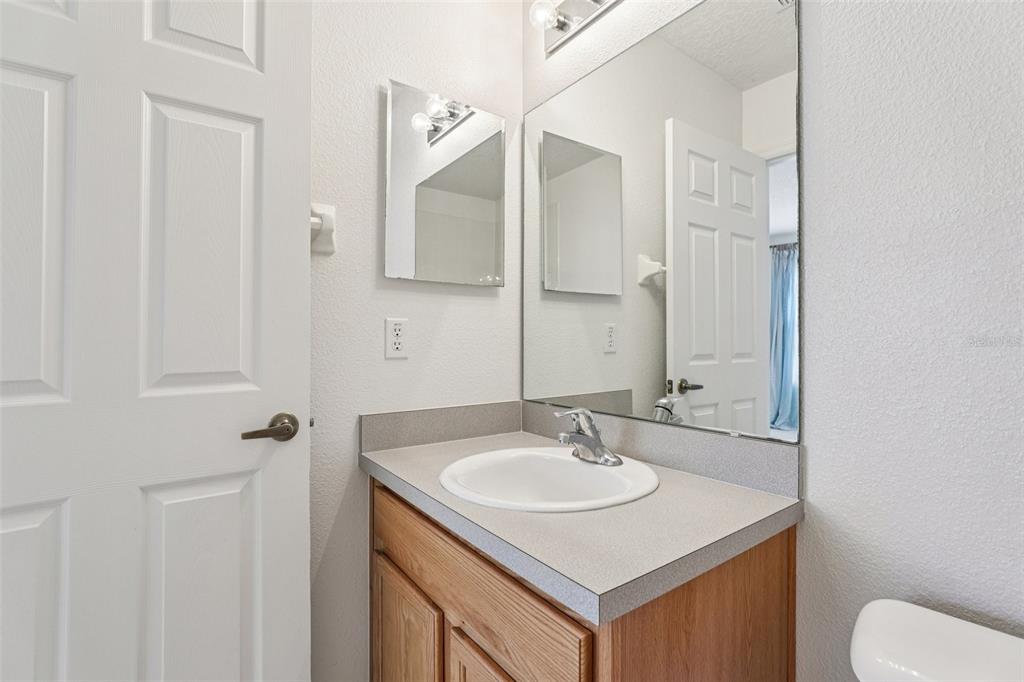 263 Sterling Springs Lane Altamonte Springs, FL 32714 - Photo 17 of 22 a bathroom with a sink and a mirror