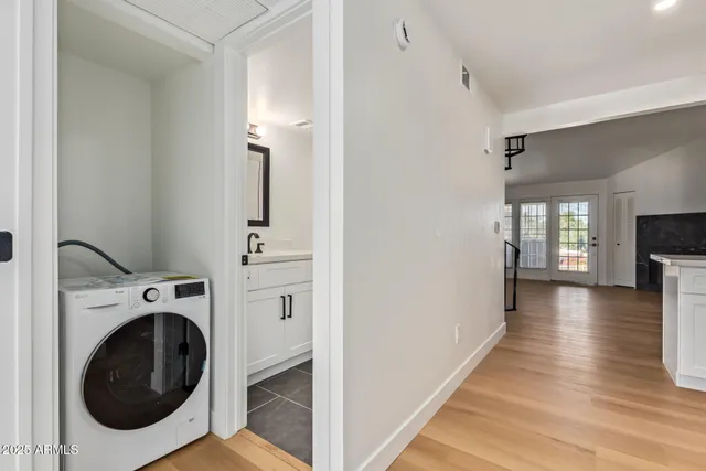 a view of a hallway with washer and dryer