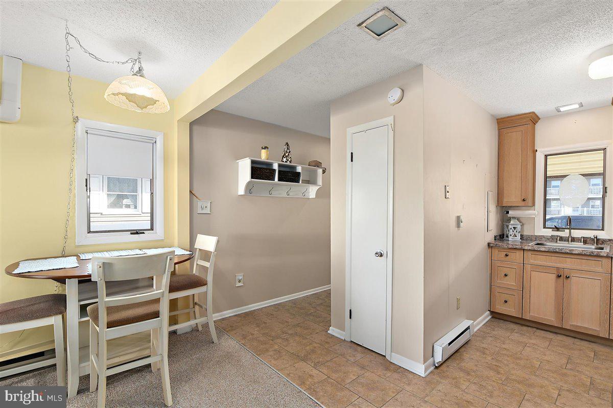 616 Salt Spray Road Ocean City, MD 21842 - Photo 17 of 40 DINING AREA, ENTRY, KITCHEN