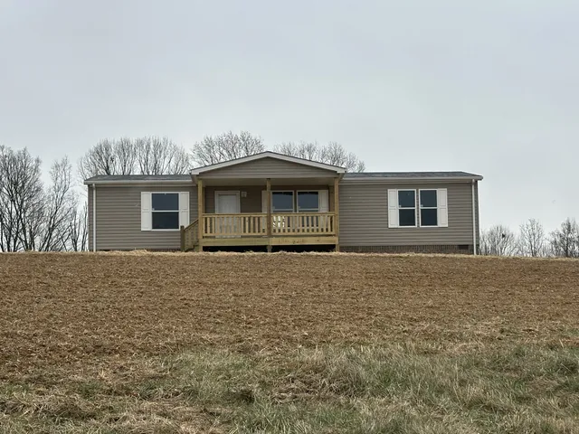 a house with trees in the background