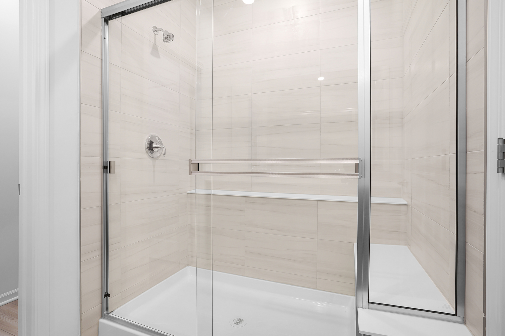 378 Cottrell Lane Aurora, IL 60506 - Photo 5 of 25 a bathroom with a glass shower door