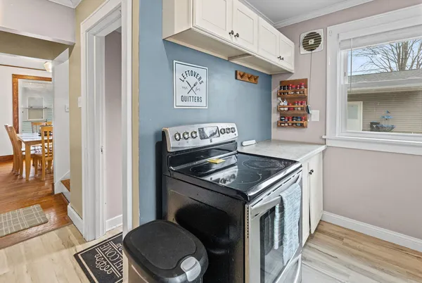 a kitchen with granite countertop a stove and a refrigerator