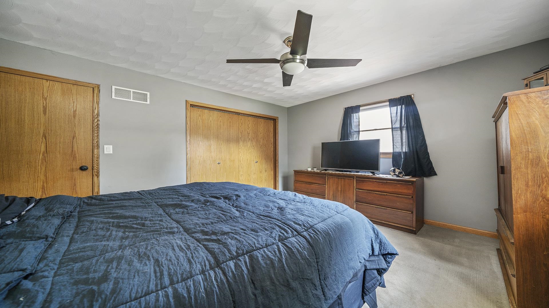 503 Sunset Drive Polo, IL 61064 - Photo 12 of 34 a bedroom with a bed and a flat screen tv