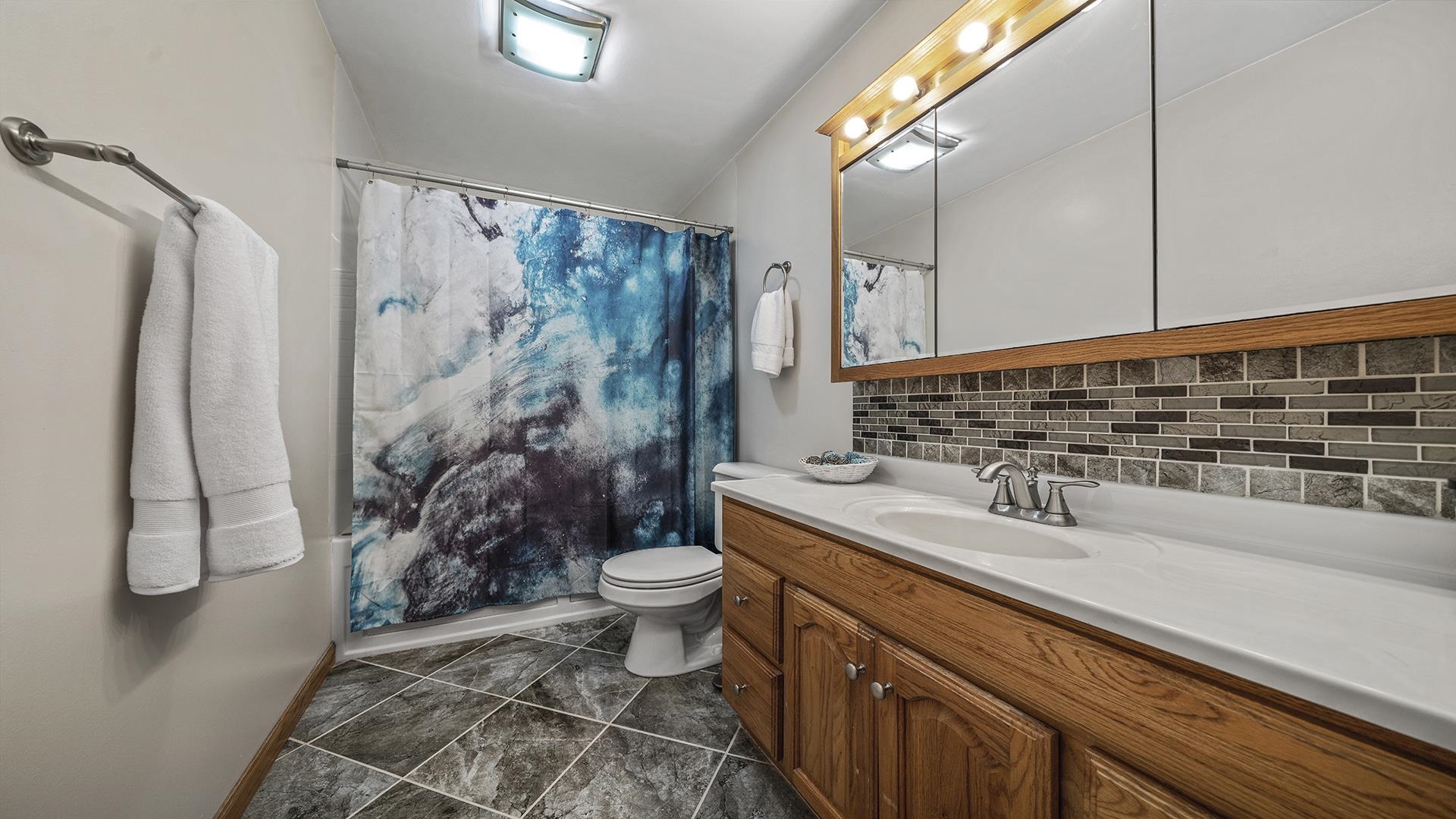 503 Sunset Drive Polo, IL 61064 - Photo 10 of 34 a bathroom with a sink toilet and shower