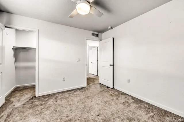 an empty room with a bathroom
