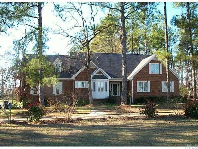 4201 Lassiter Road Wake Forest, NC 27587 - Photo 1 of 1 a front view of a house with a tree in front