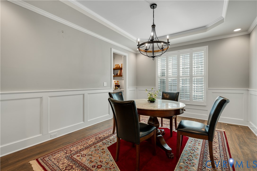 9419 Widthby Road Chesterfield, VA 23832 - Photo 8 of 23 a view of a dining room with furniture window and wooden floor