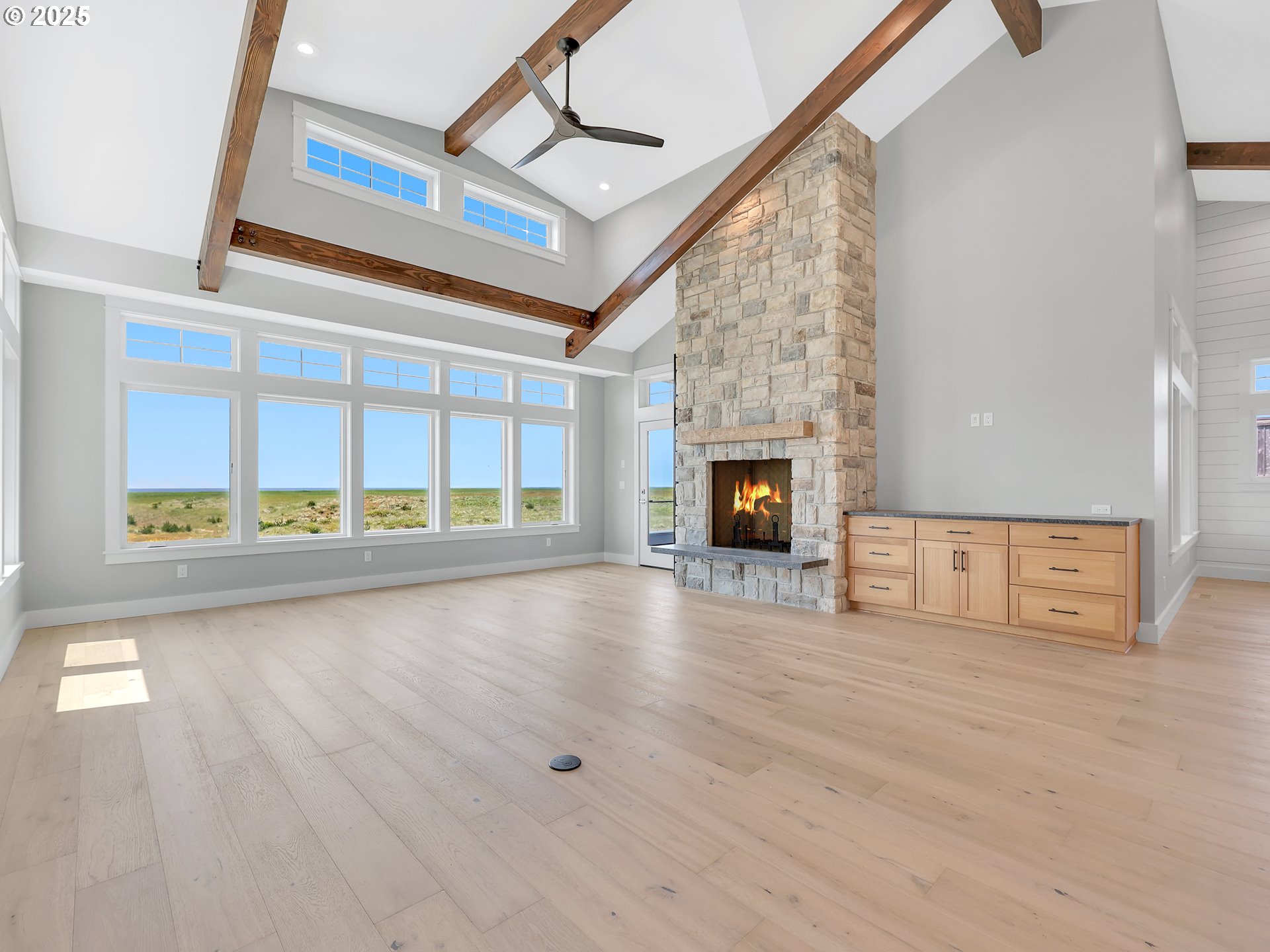 1400 North Ocean Avenue Gearhart, OR 97138 - Photo 12 of 35 a view of an empty room with a fireplace and a window