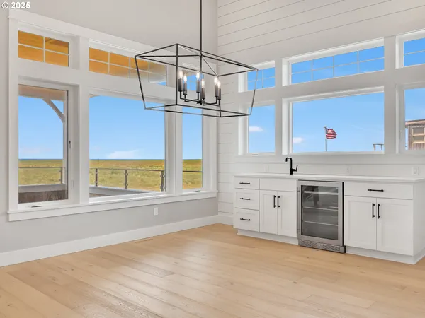 a view of a kitchen with a sink cabinet and a window