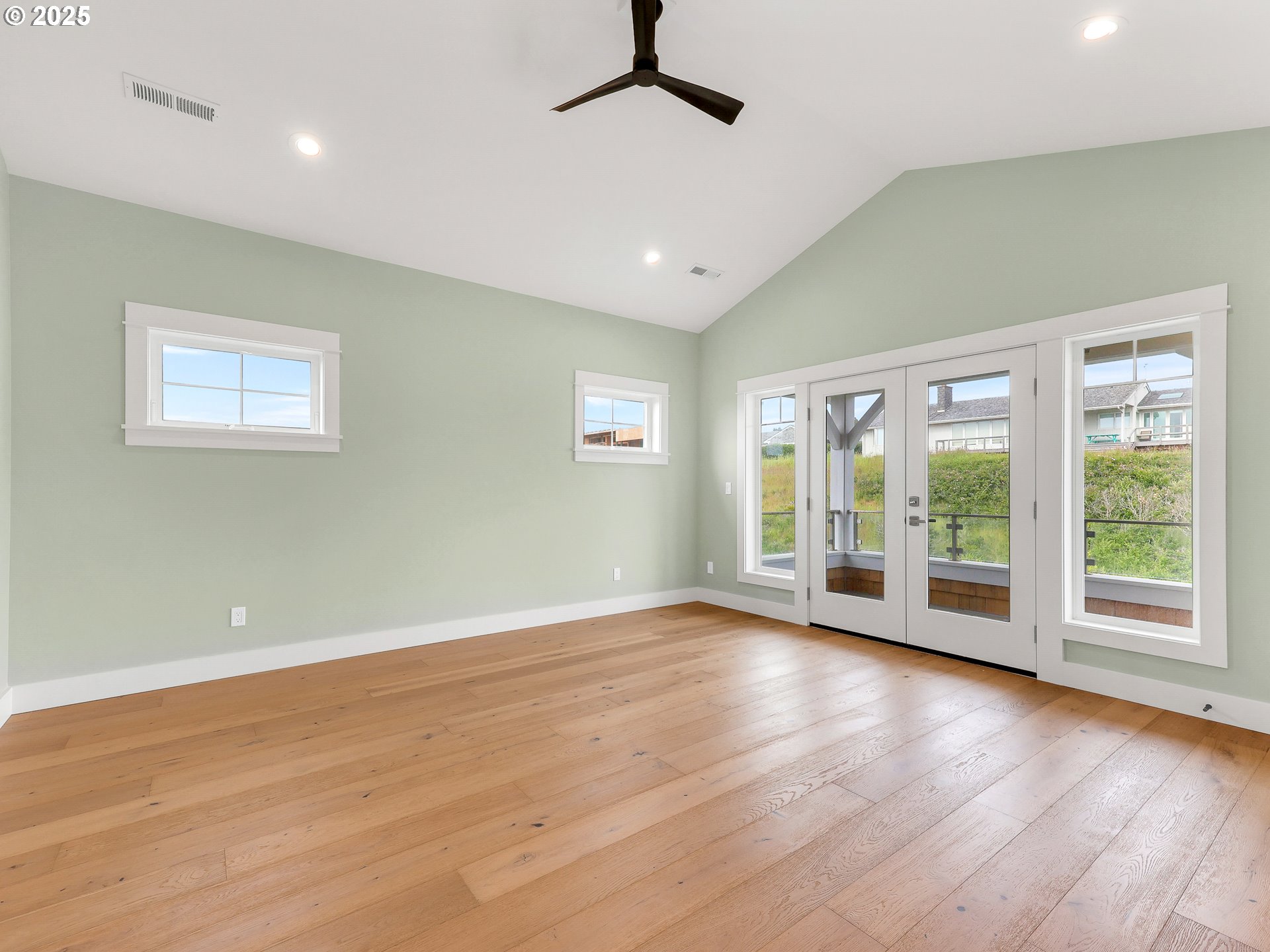 1400 North Ocean Avenue Gearhart, OR 97138 - Photo 23 of 35 a view of room with window hardwood floor and ceiling fan