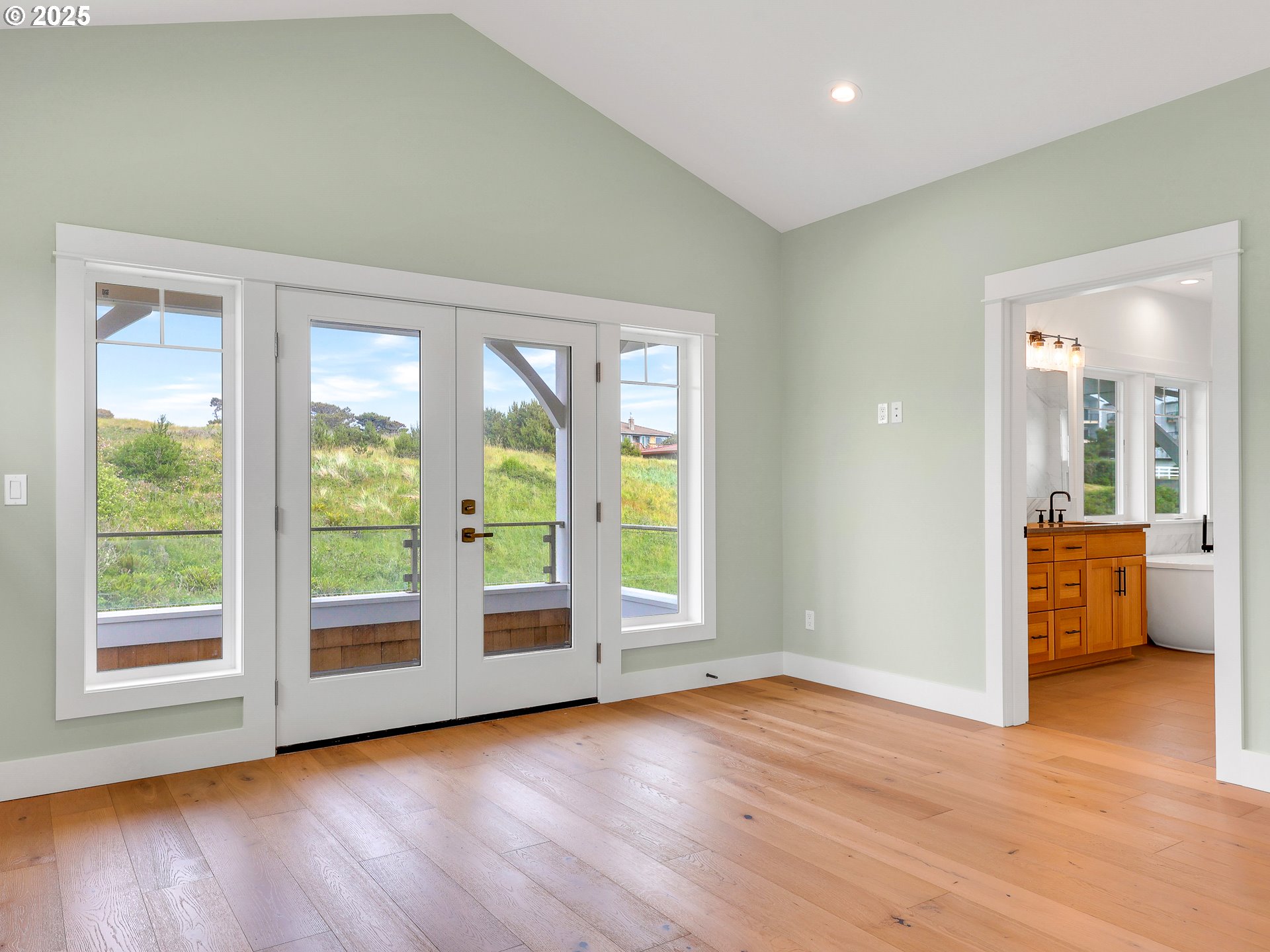 1400 North Ocean Avenue Gearhart, OR 97138 - Photo 24 of 35 a view of an empty room with wooden floor and a window
