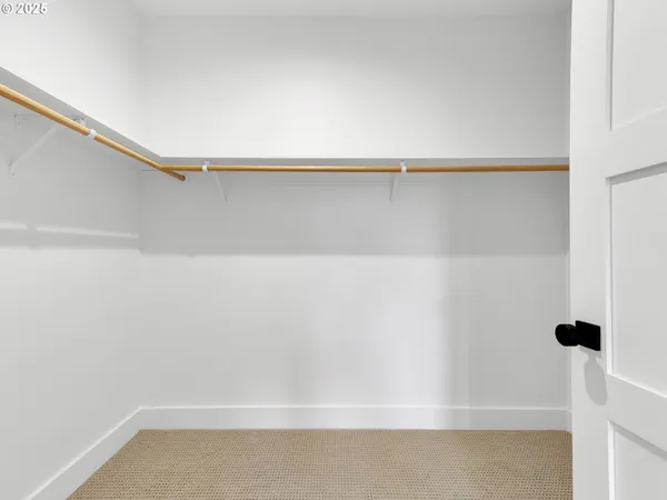 a view of a bedroom with furniture and windows