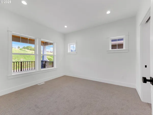 a bathroom with a double vanity sink double mirror and shower