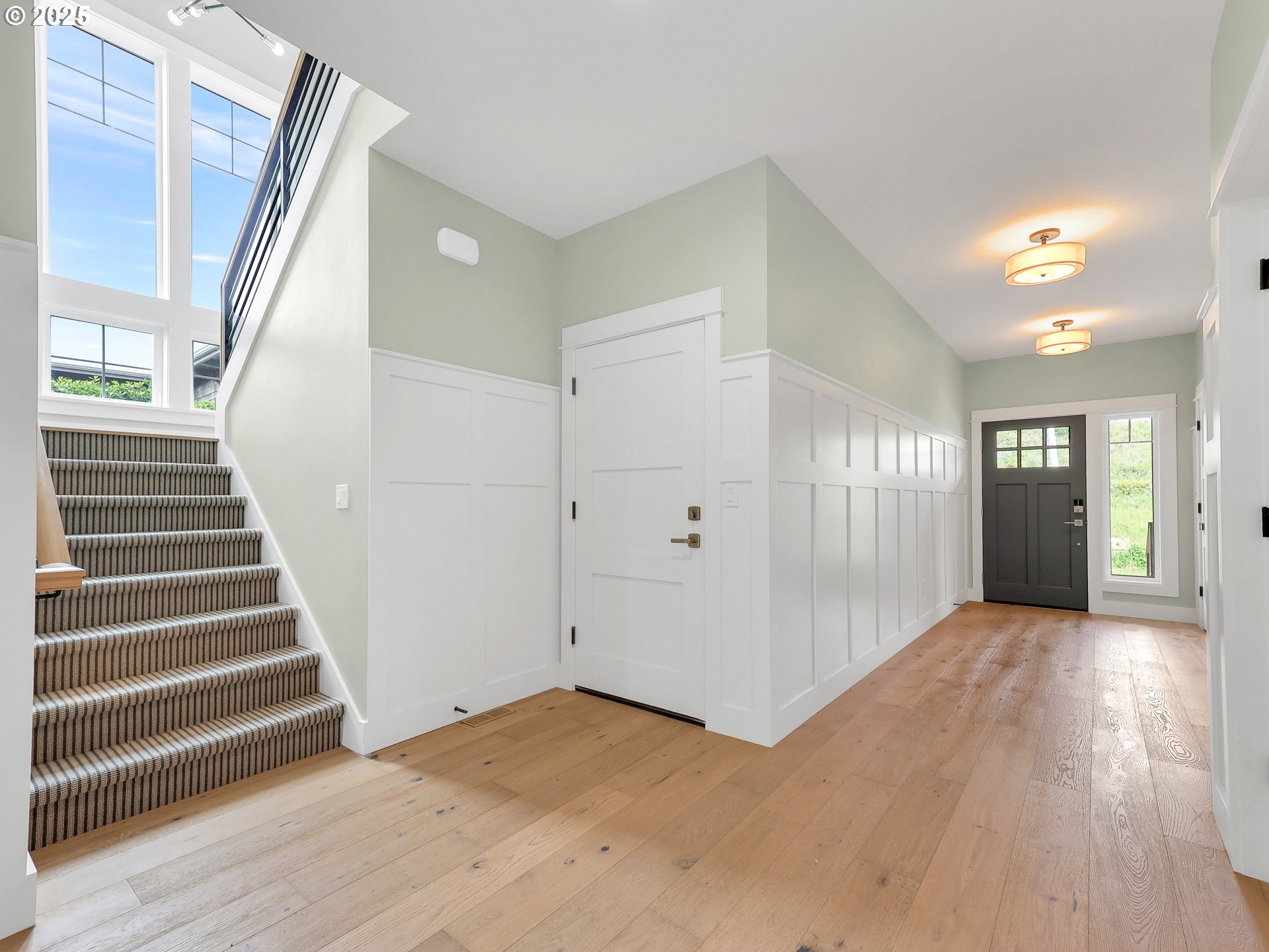 1400 North Ocean Avenue Gearhart, OR 97138 - Photo 9 of 35 a view of an entryway with wooden floor and stairs