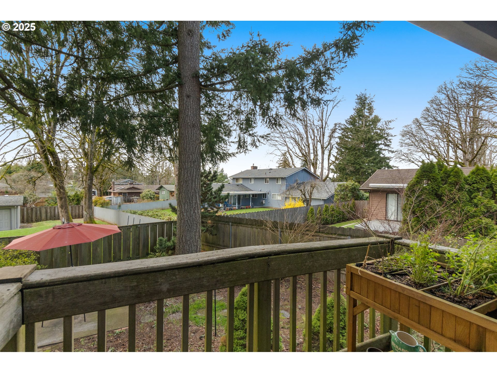 303 Cherry Avenue Oregon City, OR 97045 - Photo 11 of 30 a view of a wooden fence next to a yard