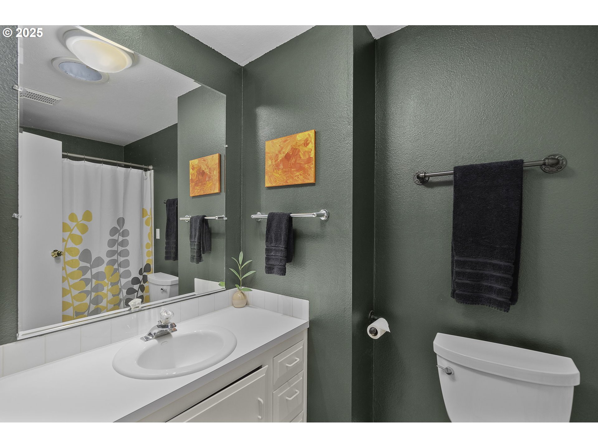 303 Cherry Avenue Oregon City, OR 97045 - Photo 17 of 30 a bathroom with a sink and a mirror