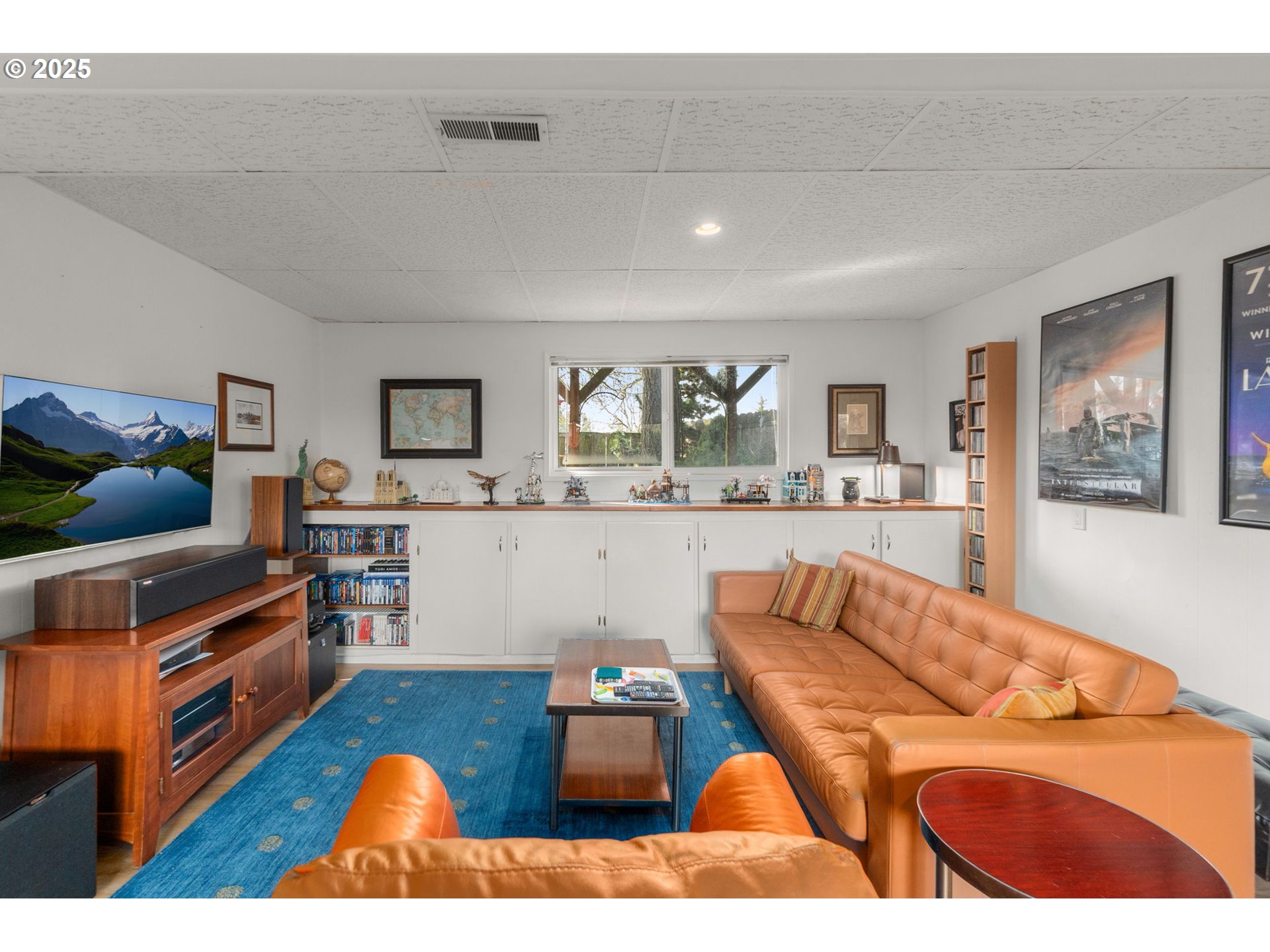 303 Cherry Avenue Oregon City, OR 97045 - Photo 18 of 30 a living room with furniture and a flat screen tv