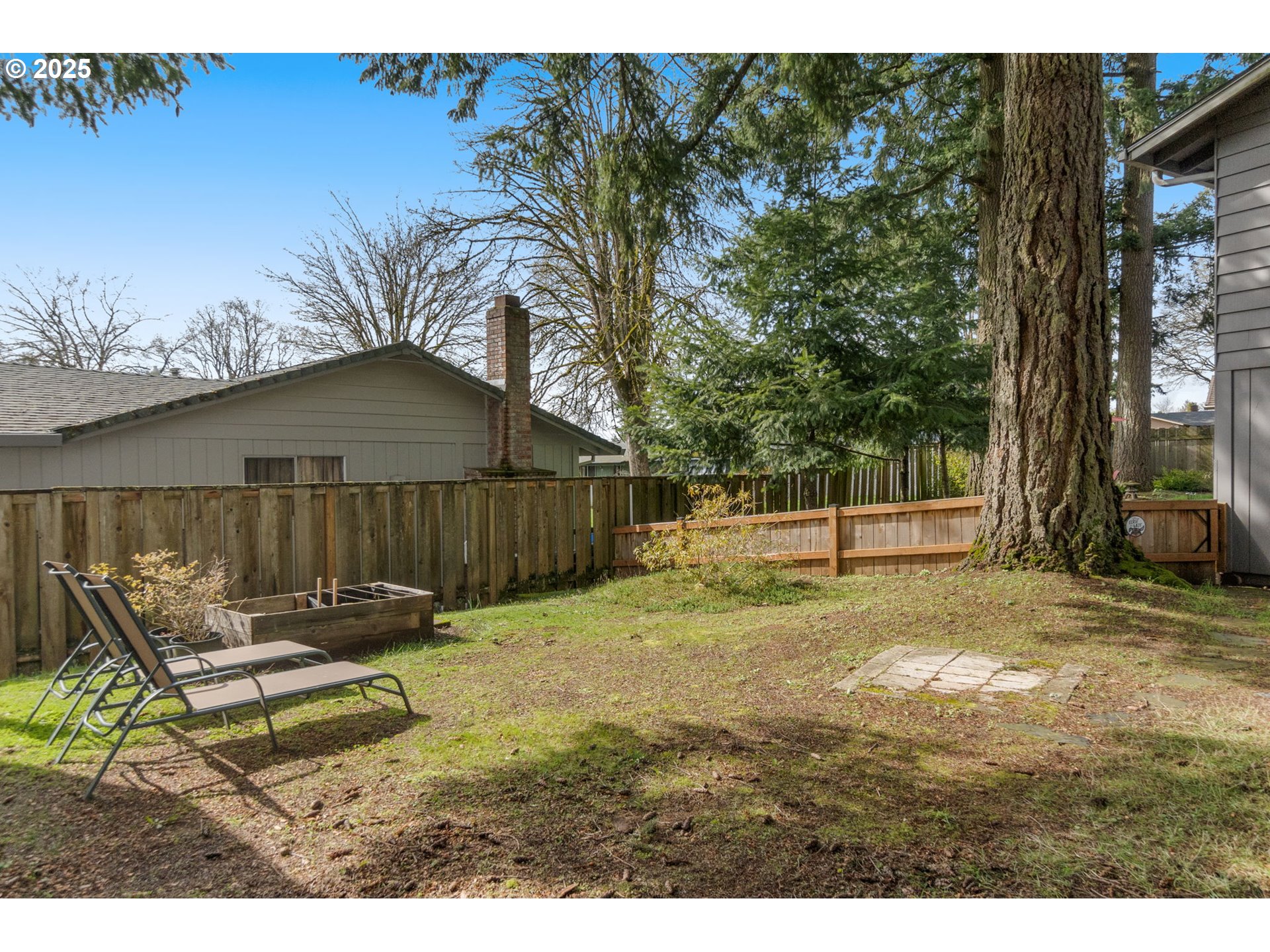 303 Cherry Avenue Oregon City, OR 97045 - Photo 25 of 30 a backyard of a house with table and chairs