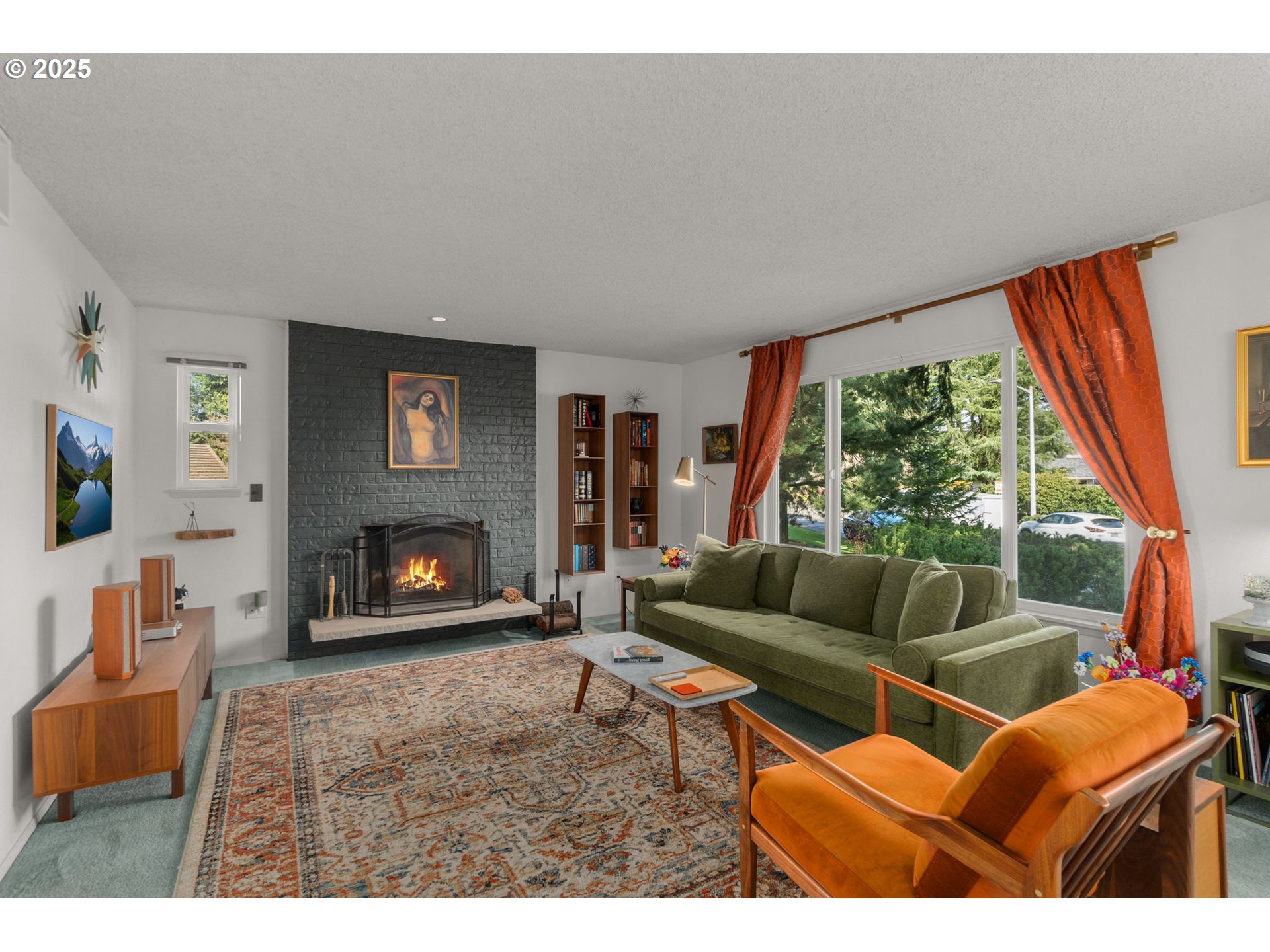 303 Cherry Avenue Oregon City, OR 97045 - Photo 4 of 30 a living room with furniture a flat screen tv and a fireplace