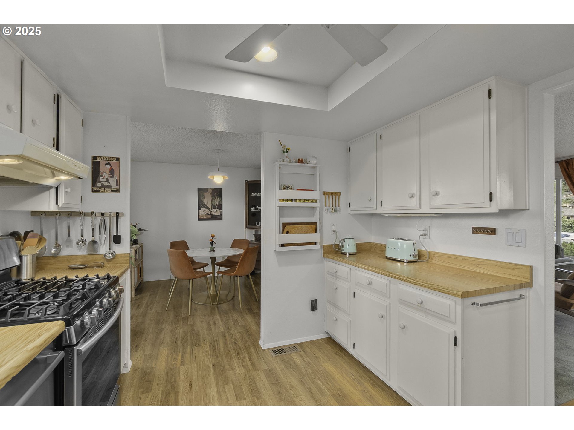 303 Cherry Avenue Oregon City, OR 97045 - Photo 8 of 30 a kitchen with a sink and cabinets