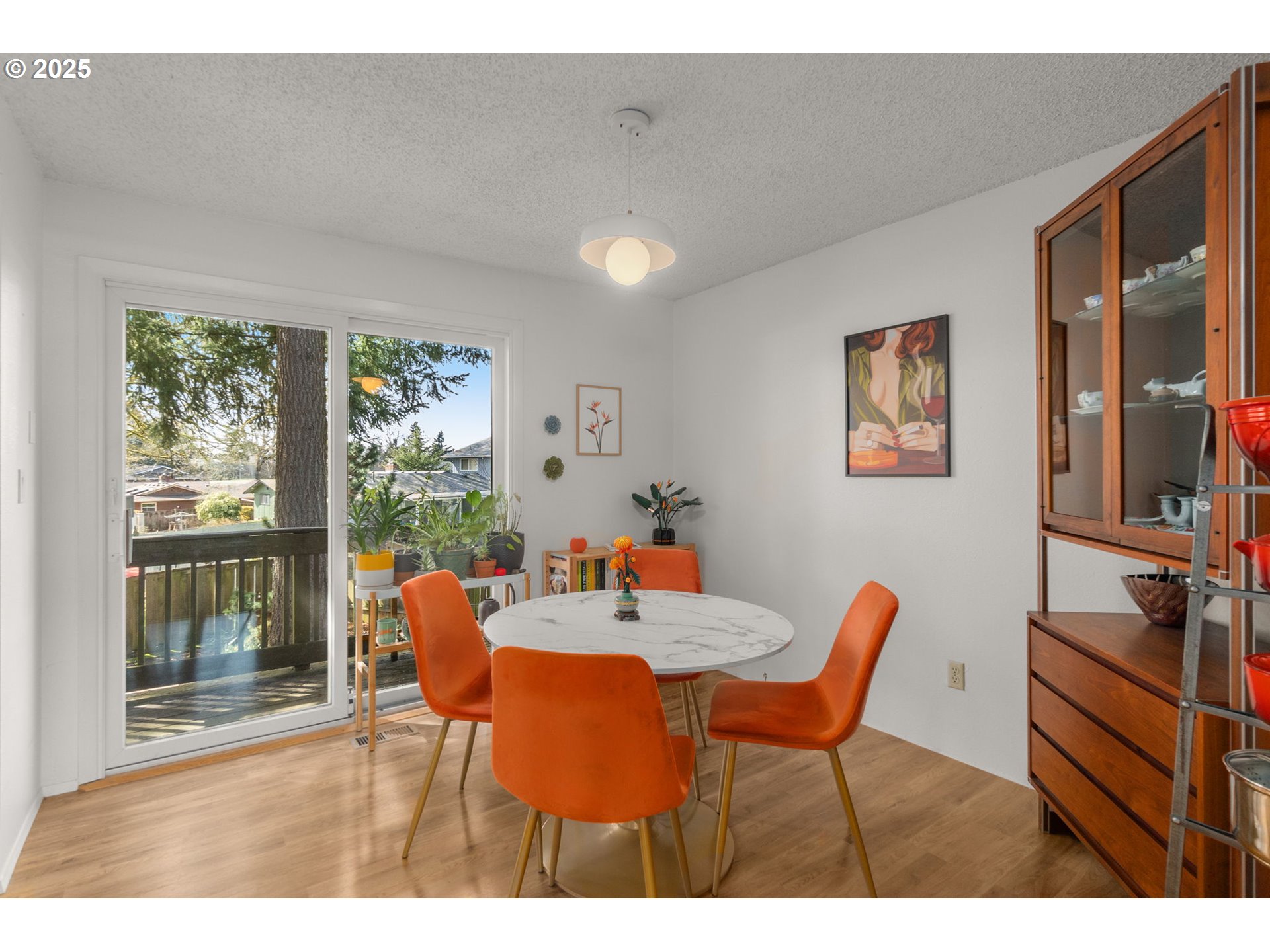 303 Cherry Avenue Oregon City, OR 97045 - Photo 10 of 30 a dining room with furniture and a floor to ceiling window